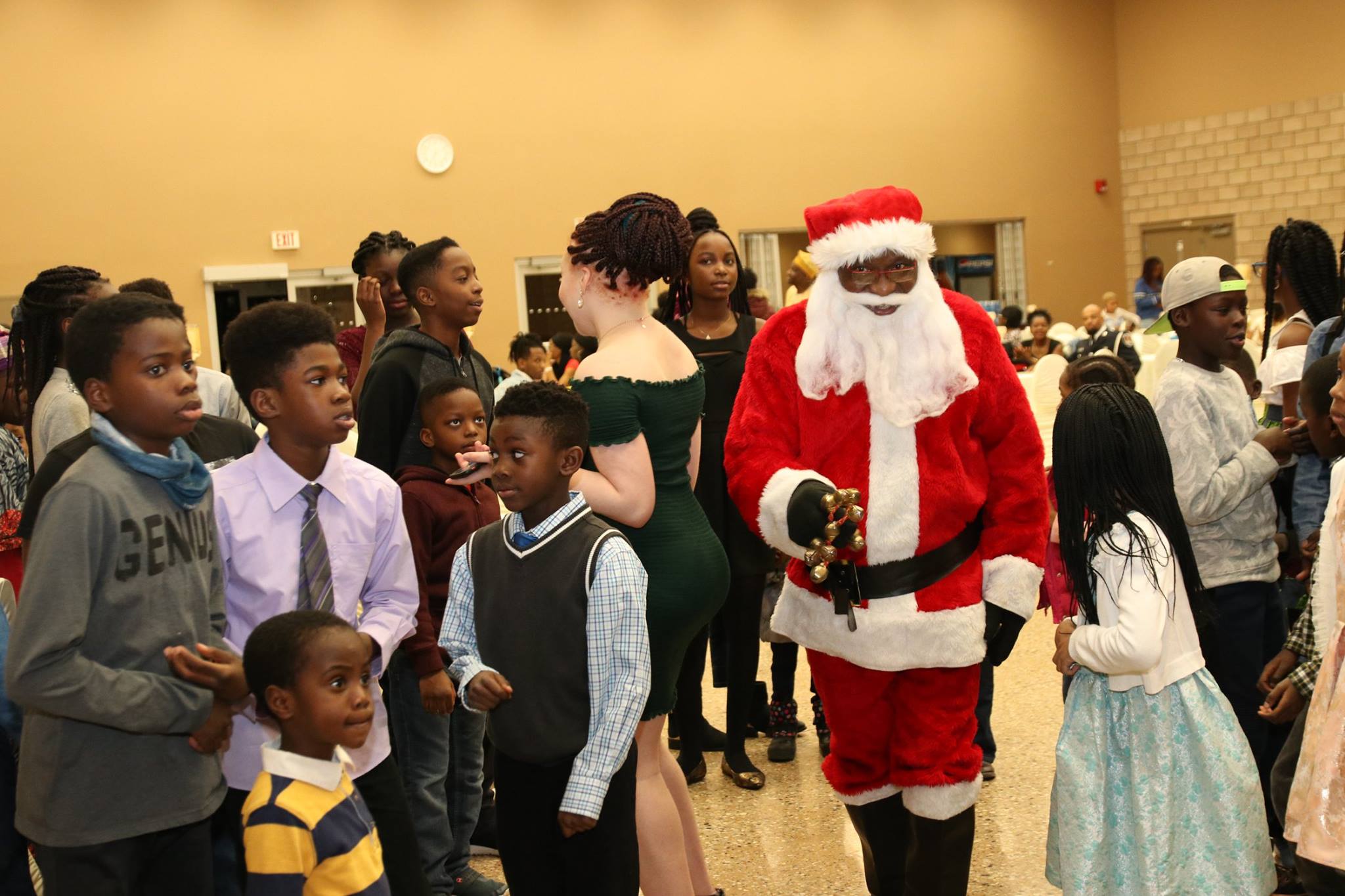 father christmas surrounded by children